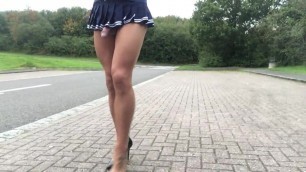Public road walking in pantyhose and mini skirt .