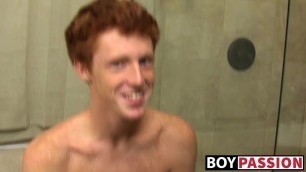 Redhead twink Alan Parish masturbates and cums under shower